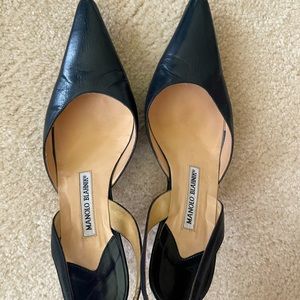 Beautiful navy blue Manolo Blahnik sling back pumps.